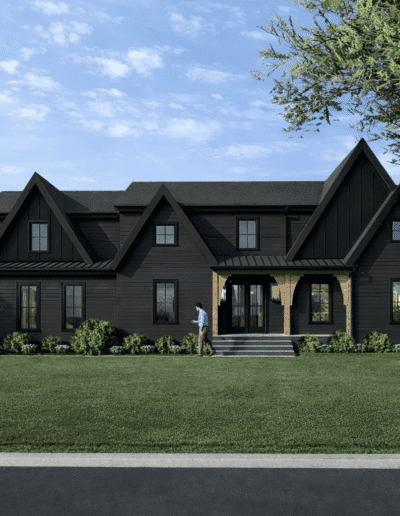 A large, modern black house with multiple peaked roofs, surrounded by green lawn and trees, with a person standing near the front steps under a covered porch.